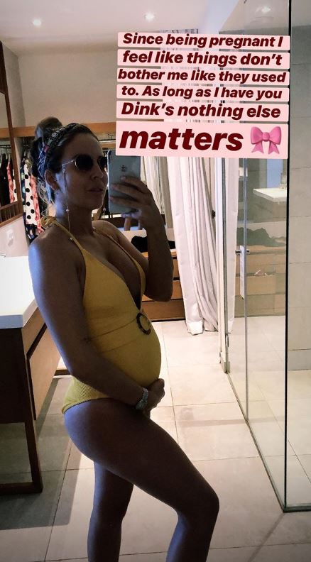  Lydia posed in a yellow swimsuit to highlight her growing bump