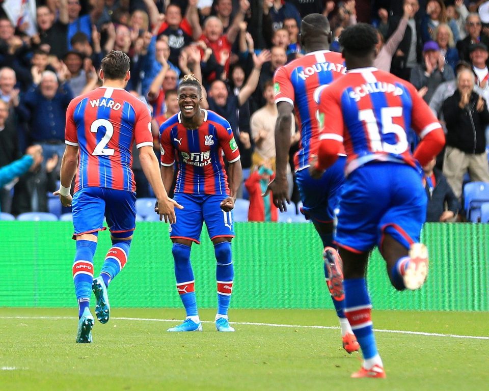  Palace players rush to congratulate Wilfried Zaha after the opener, albeit an own goal from Wovlves' Leander Dendoncker