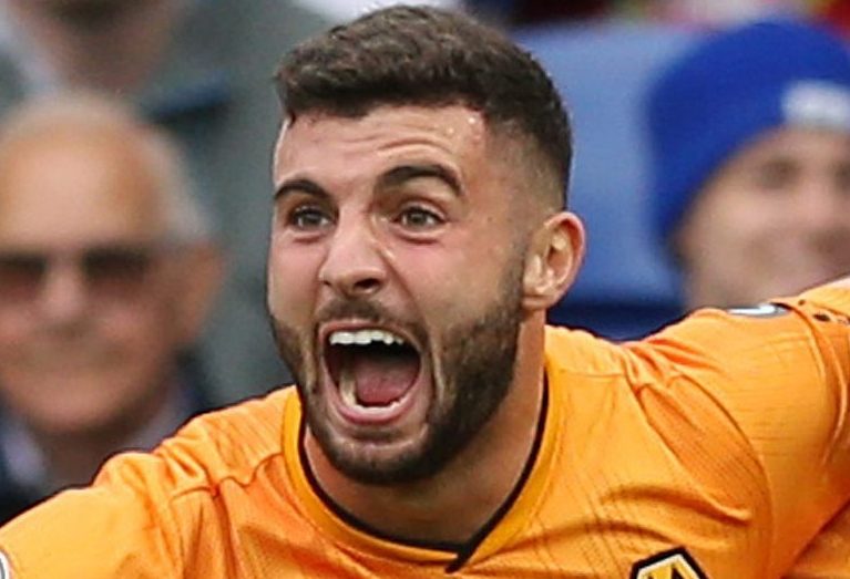  Patrick Cutrone helps Wolves' last-gasp point-saver Diogo Jota celebrate