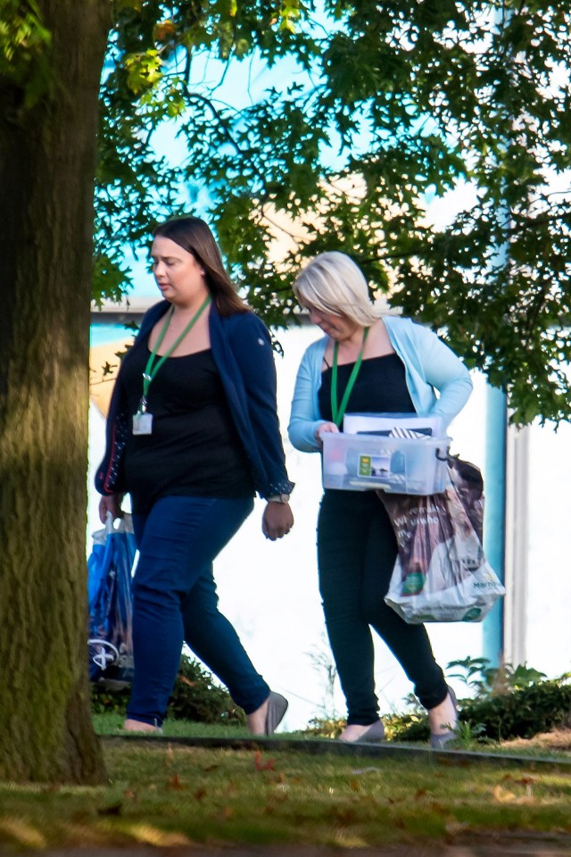  Some workers could be seen leaving the office clutching their belongings