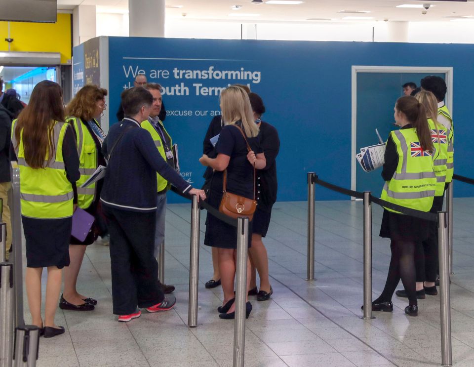  Staff from Tui help Government officials at Gatwick Airport after tour operator Thomas Cook ceased trading