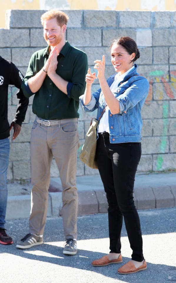  The couple kept it casual for today's visit to the charity