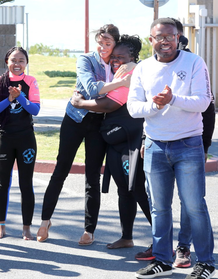  Meghan Markle doled out hugs to many of the young women