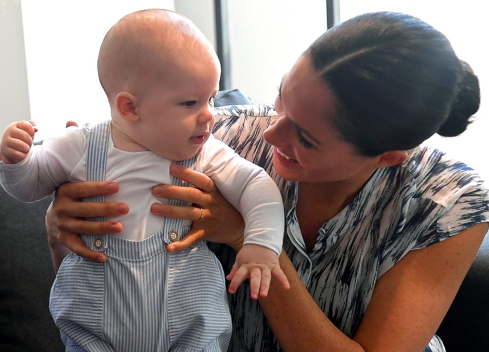  Sweet photos show mum Meghan cooing over Archie