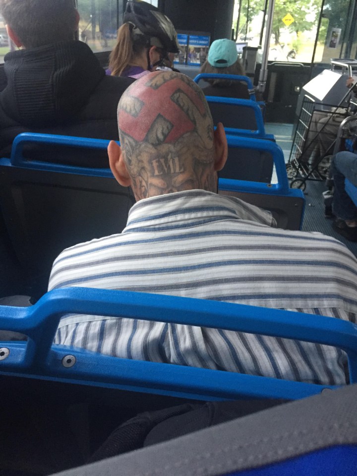  This bald man has used his entire head as a beacon to display his beliefs