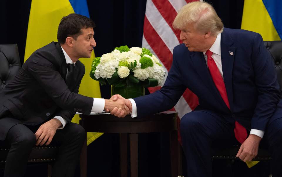  Trump and Ukrainian President Volodymyr Zelensky shake hands during a meeting in New York today