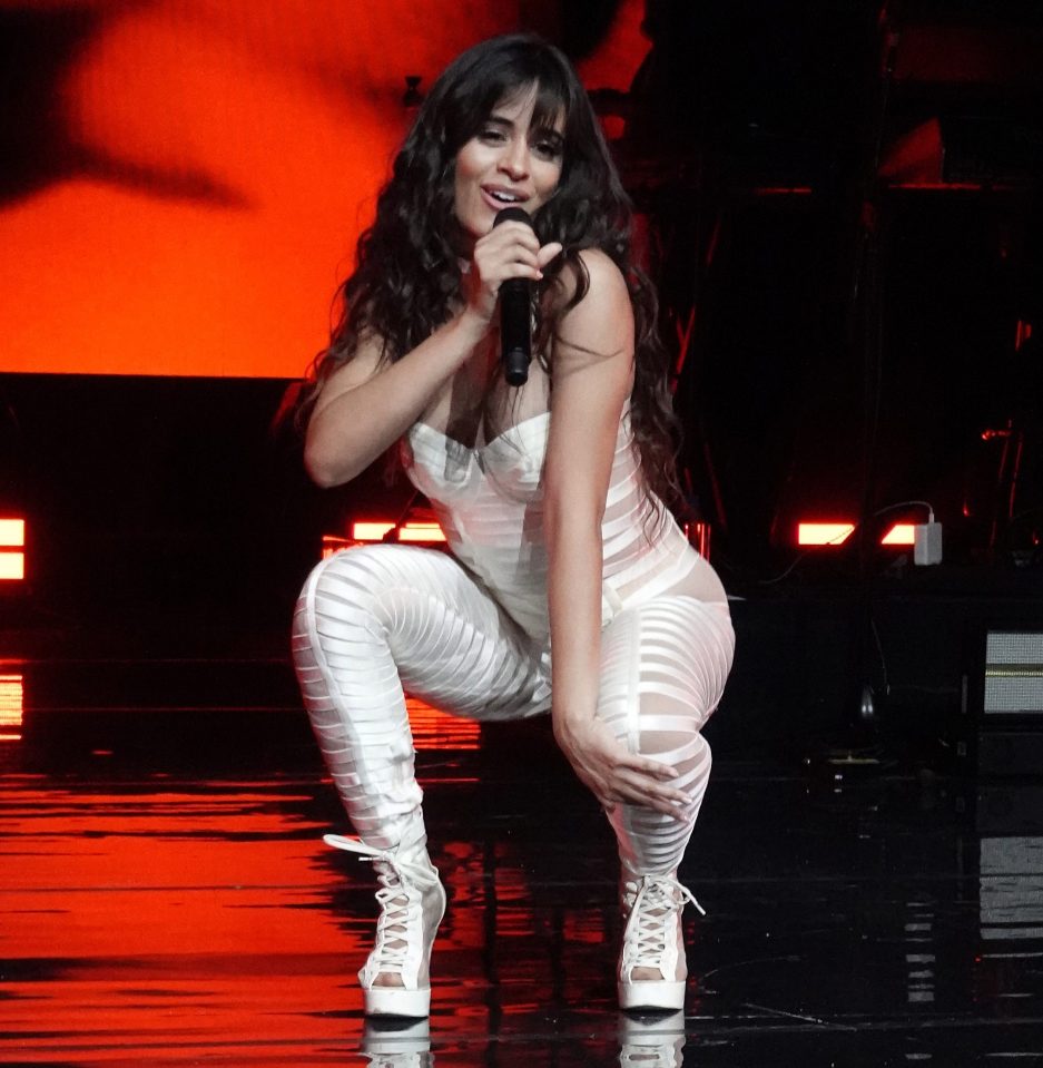  Havana singer Camila Cabello wears a figure-hugging white jumpsuit on stage in Miami