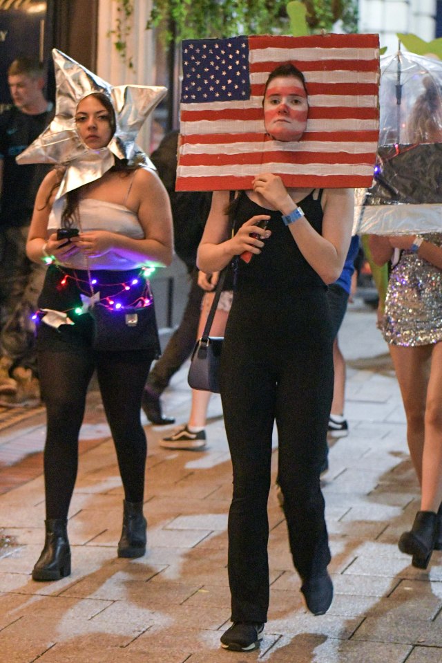  Face in a flag: A woman dresses as the American Flag