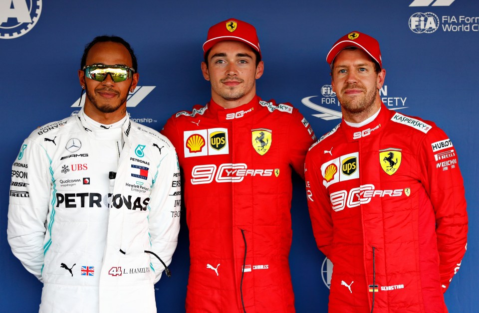 Charles Leclerc alongside Lewis Hamilton and Sebastian Vettel after the race