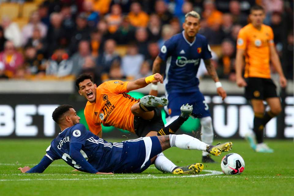  Watford midfielder Etienne Capoue in action against Wolves striker Raul Jimenez