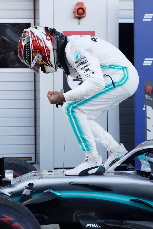  The Brit celebrates extending his lead at the top of the driver's championship