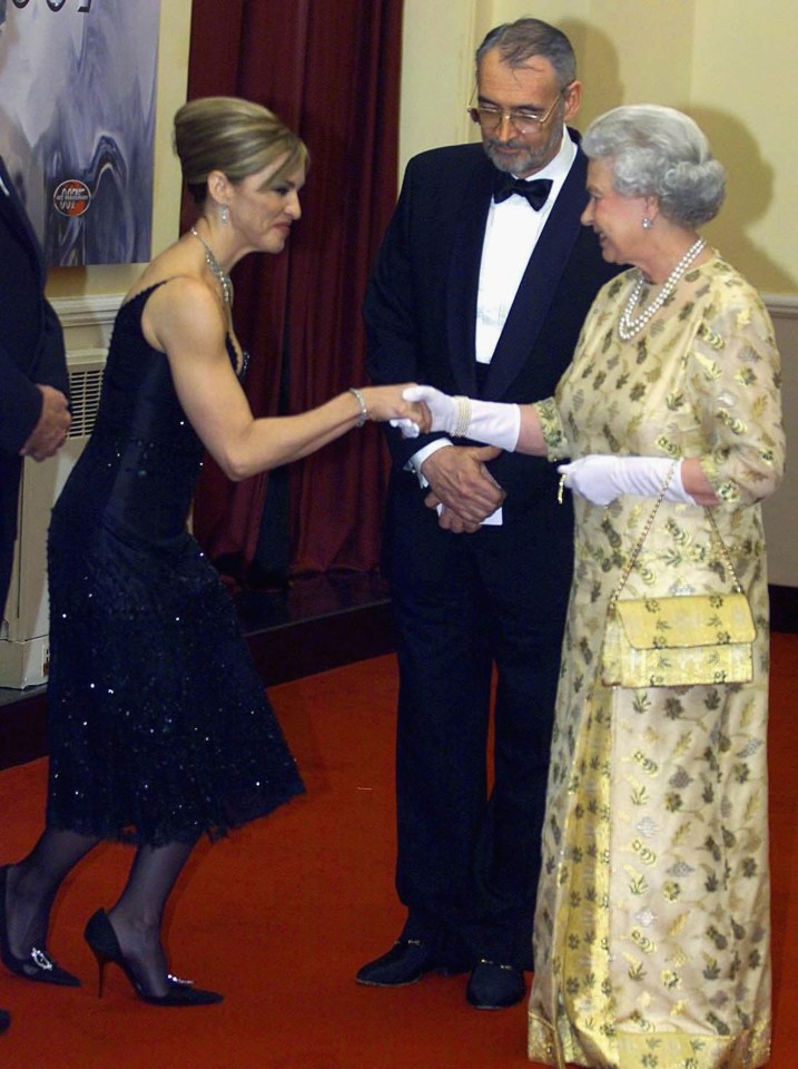  Madonna was practising her curtsy with co-star John Cleese before meeting The Queen at the 2002 James Bond Die Another Day premiere