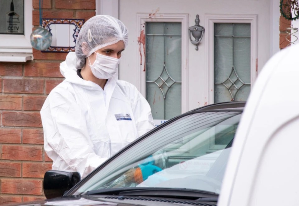 Chilling photos from the scene show blood stains on the door of the house