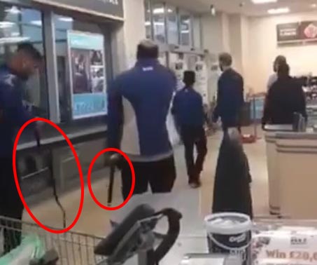  Two workers appeared to arm themselves with belts before taking on the gang