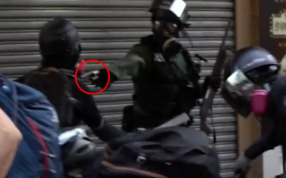  This is the moment a police officer shoots a protester in Hong Kong