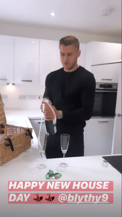  The pair celebrated with a bottle of bubbly when they moved in