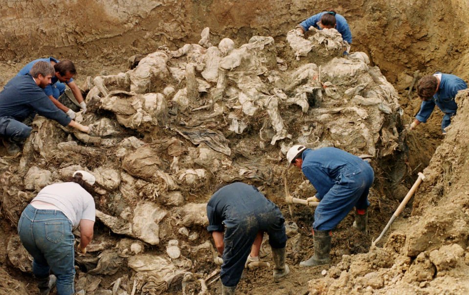  Bodies of Bosnian men and boys lie in a mass grave after the Srebrenica massacre