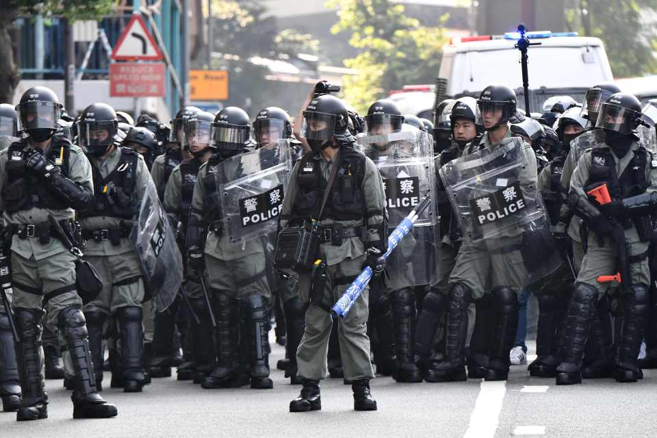  Hong Kong police take position near China's Hong Kong liaison office ahead of protesters marching