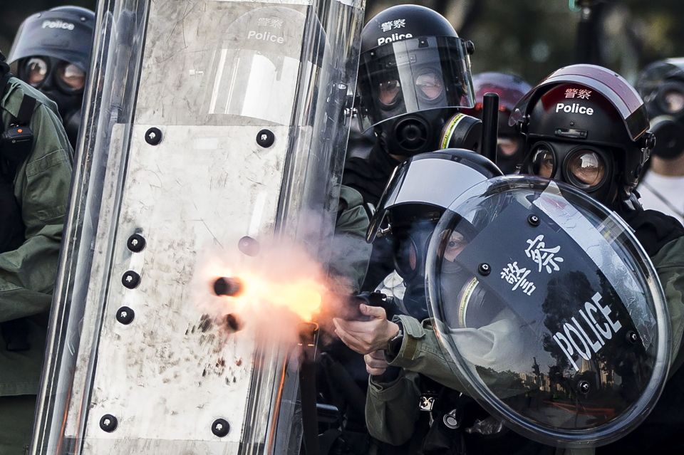  Police fire projectiles against protesters in the Sha Tin district of Hong Kong