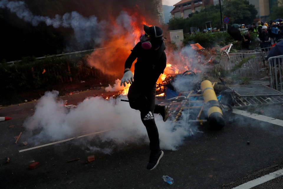  A protester reacts during a demonstration in Sha Tin district