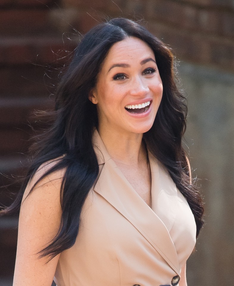  Meghan beamed on her visit to the university in Johannesburg