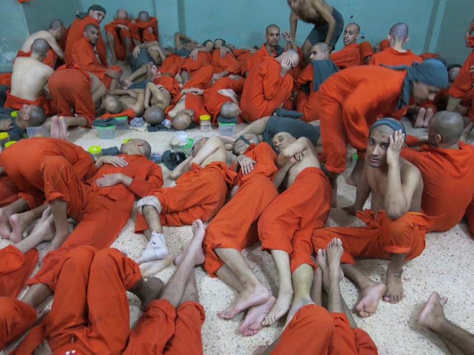  ISIS prisoners lie crammed in like sardines inside a hellish Syrian prison