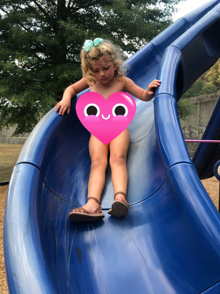  Sadie suffered an unfortunate accident while going down the slide first time - but decided to have another go while her mum's back was turned