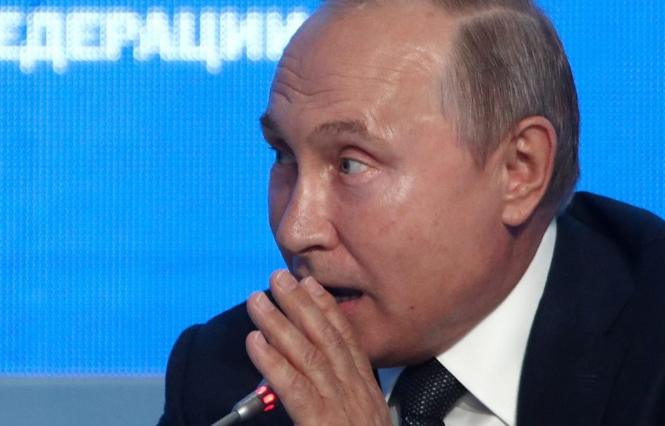  Vladimir Putin jokingly whispered that he was 'definitely' going to interfere with the US Presidential Elections next year