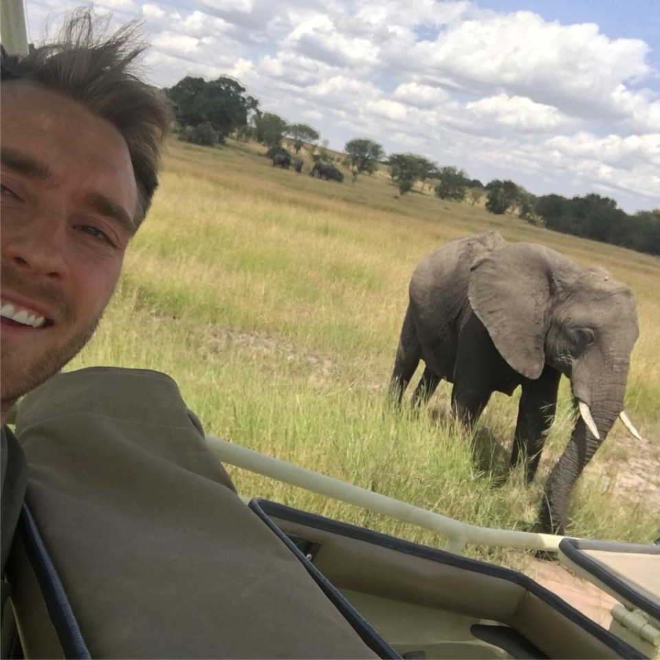 Chris pictured with an elephant in Tanzania