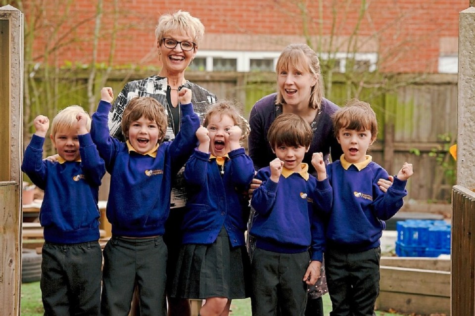  Principal of the school Jane Smalley with some of her pupils and member of staff Victoria Wearing