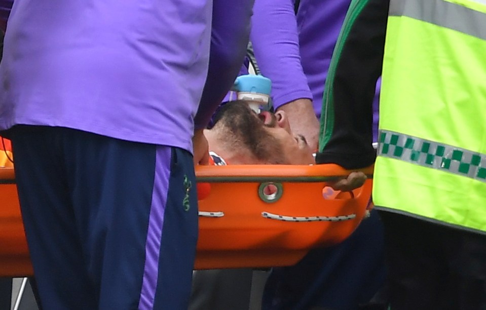  Lloris bites on the mouthpiece of the gas he was given on the pitch