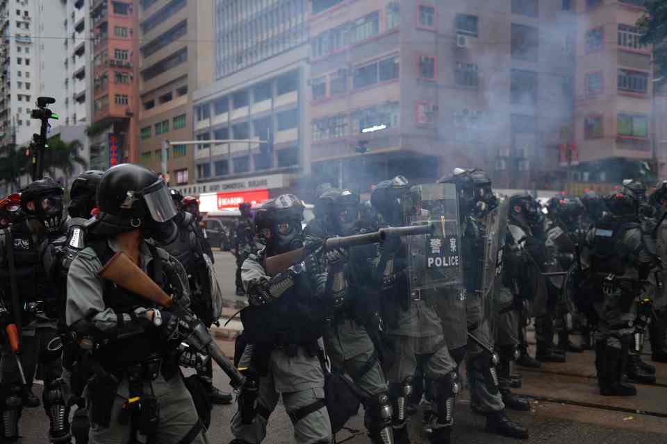  Police fire tear gas into crowds of demonstrators yesterday