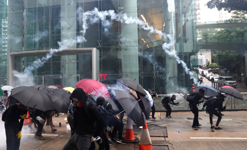  Activists used their trademark umbrellas to defend against missiles