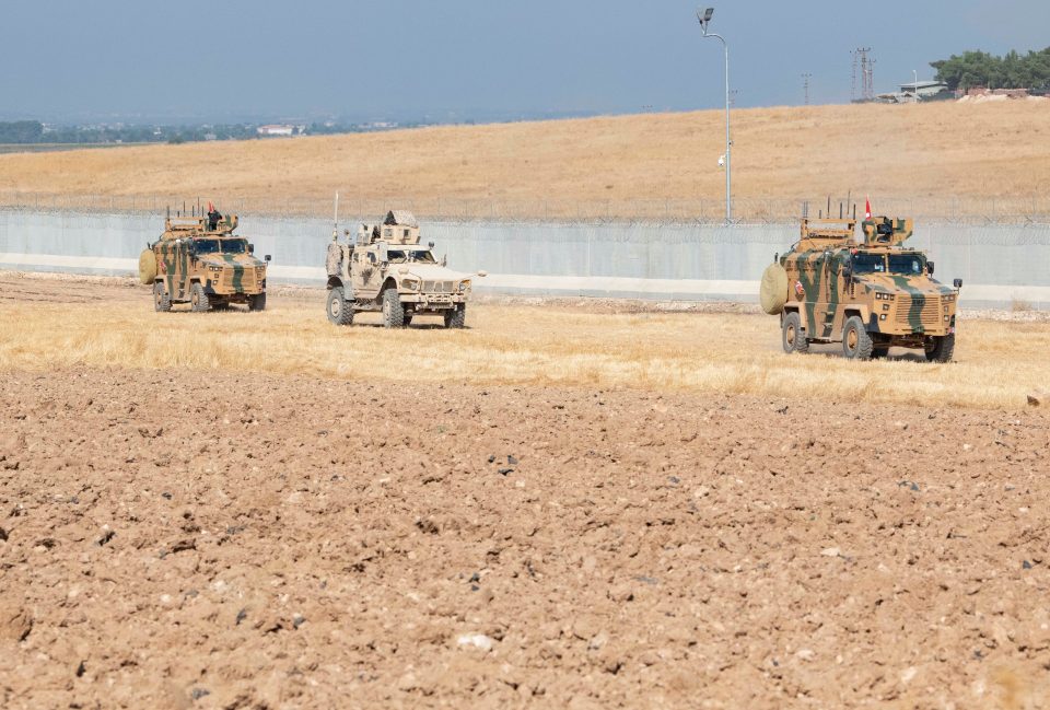  A photo issued on Monday showing US and Turkish military forces in armoured trucks