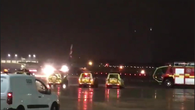  Emergency services were snapped lying in wait for a British Airways pilot who threw up after the cockpit became contaminated with toxic fumes last month