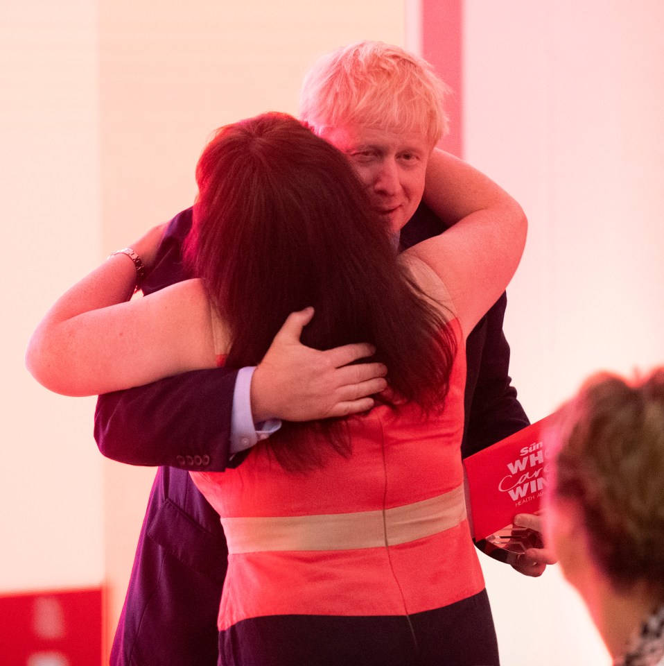  Winner Ruth Lowe hugs the Prime Minister as he presents her with her Who Cares Wins award