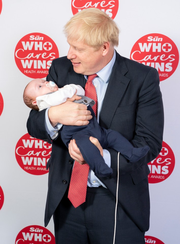  Boris Johnson attended The Sun’s Who Cares Wins awards ceremony - he was pictured holding Logan Clifford