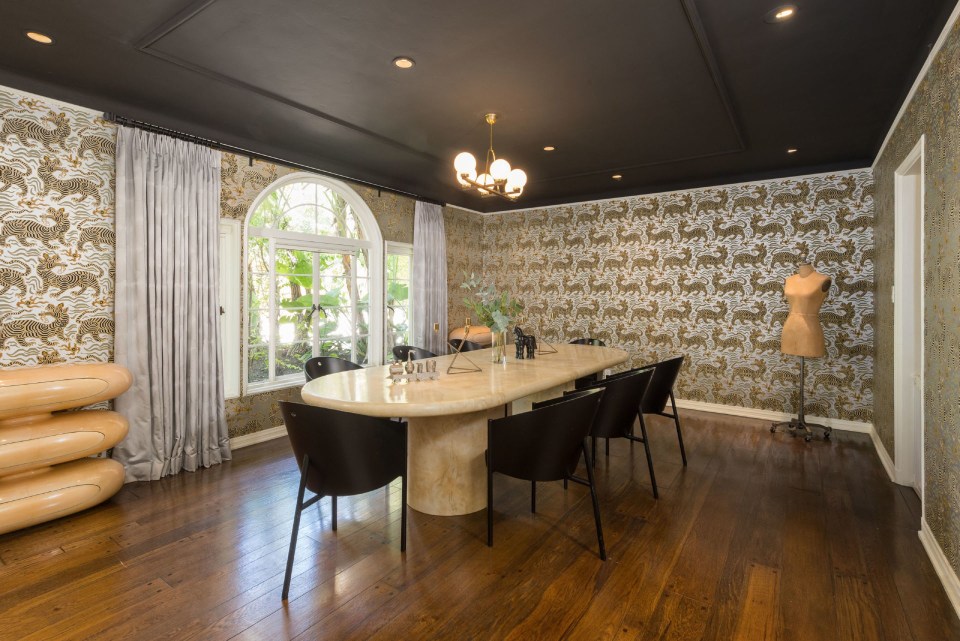  Mark's eccentric decor choices include dragon print wallpaper in the dining room