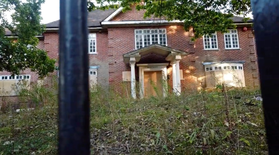  This home has been fully boarded up and is gradually being swallowed by the weeds