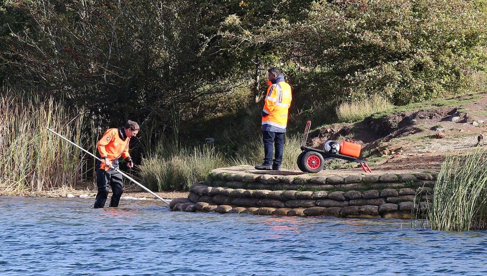  Police are seen here searching the shallow parts of the Blue Lagoon