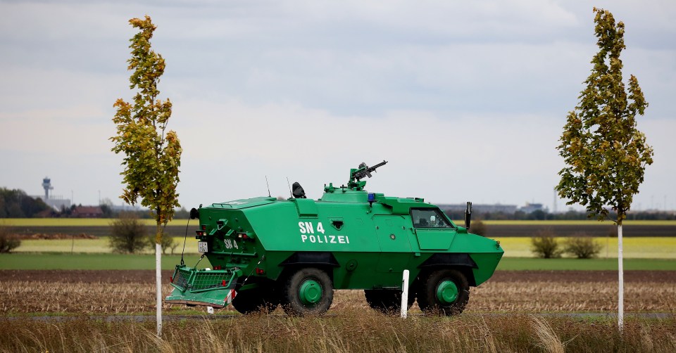 An armed tank is bought in as police secure the area between Wiedersdorf and Landsberg