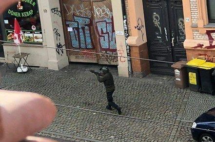 This shocking photo shows a man near a kebab shop which was also targeted