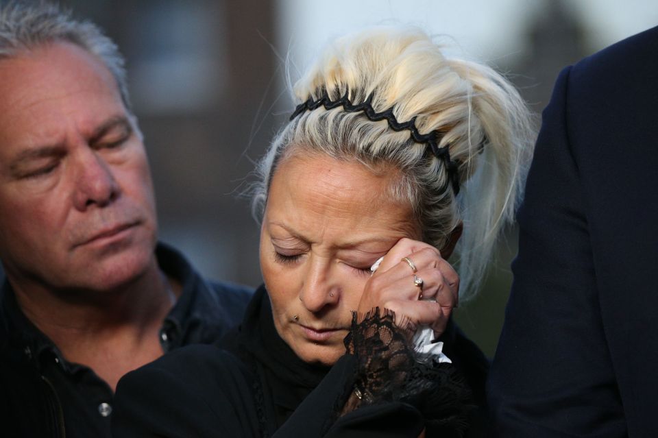  Charlotte wipes away tears after leaving the Foreign and Commonwealth Office