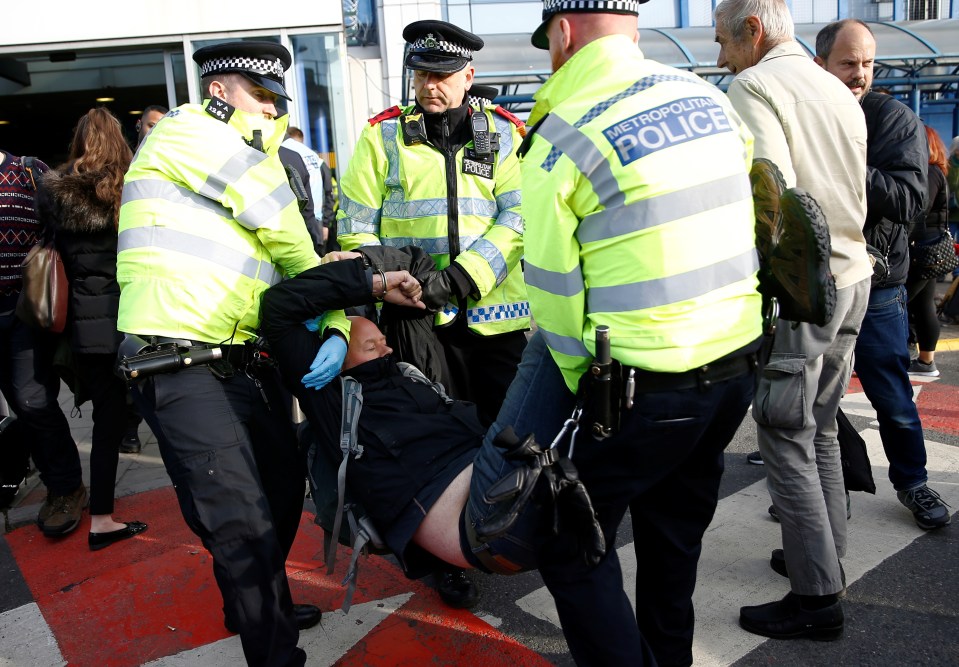  Police removed protesters from outside the airport and the DLR station nearby