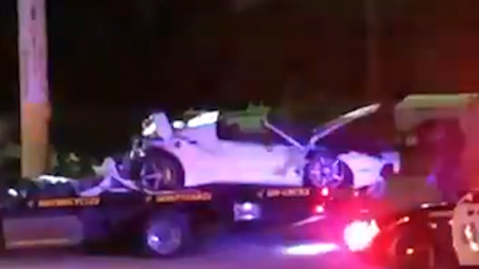  The wreckage of the Ferrari was loaded on to a tow-truck in Dallas