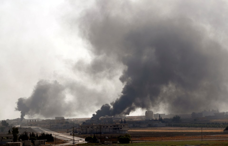  Smoke rises over the Syrian town of Tel Abyad