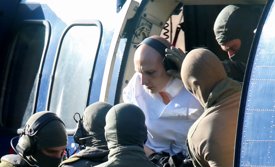 German special police escorts the suspect prior to a hearing at the Federal Court in Karlsruhe