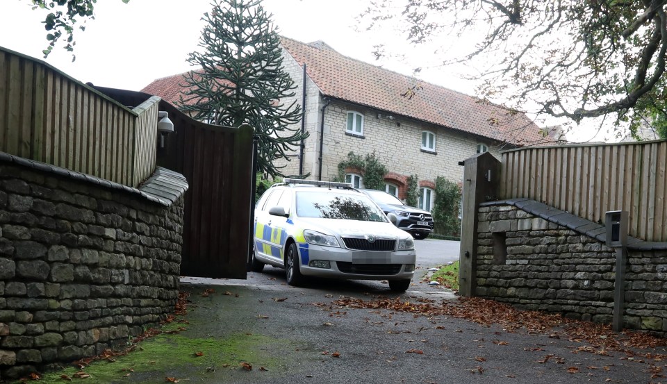  A police car leaves the home of Jamie and Rebekah Vardy