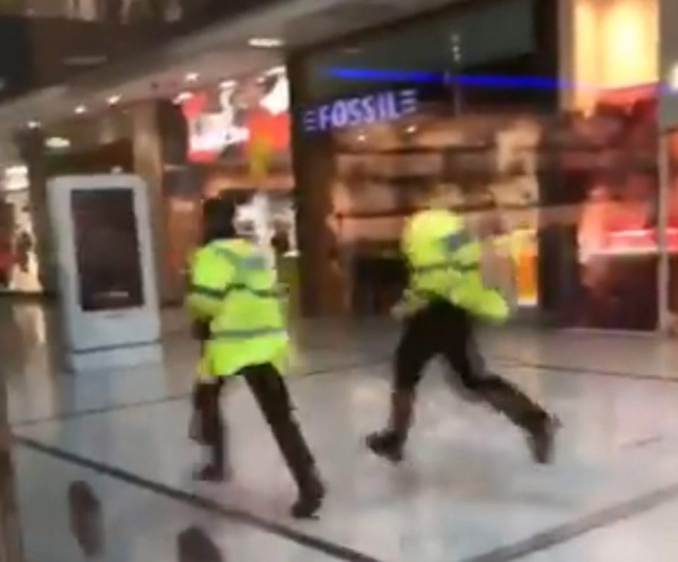  Officers race through the shopping centre following the rampage