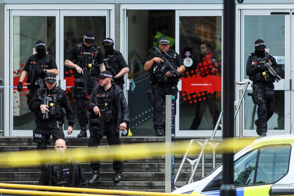  Armed cops respond to reports of the suspected terror attack on shoppers